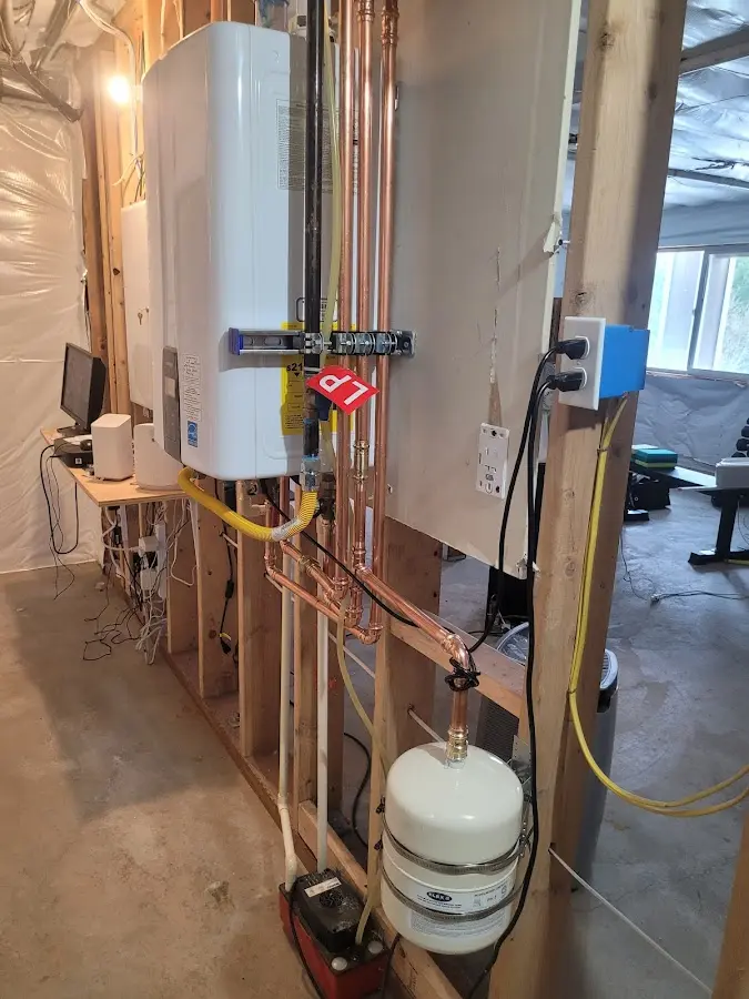 Licensed plumber repairing a kitchen sink in Broken Arrow